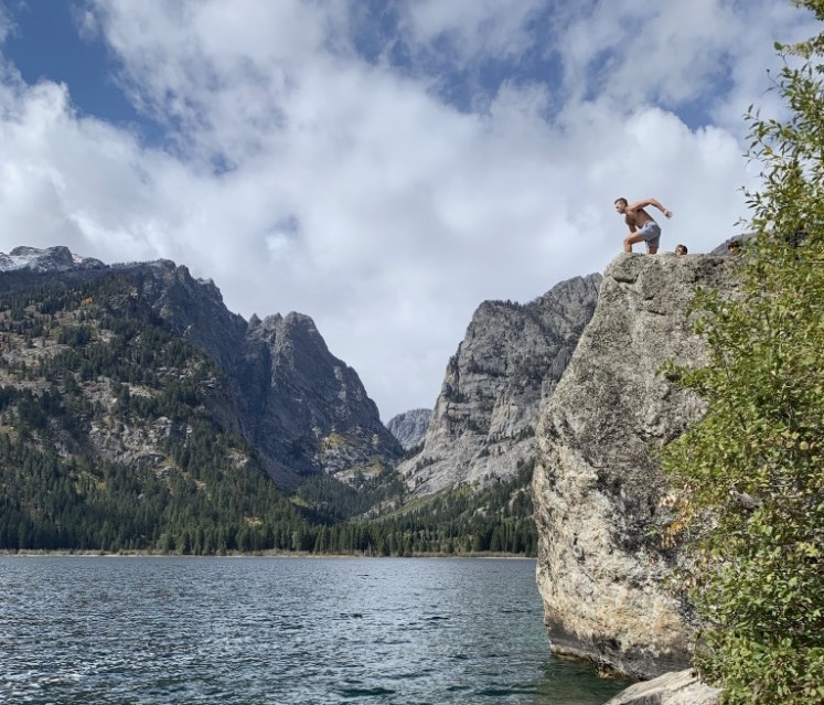 Alex jumping into Phelps Lake